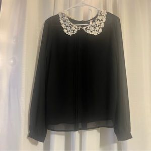 Black blouse with off white lace collar. Button up on the back.